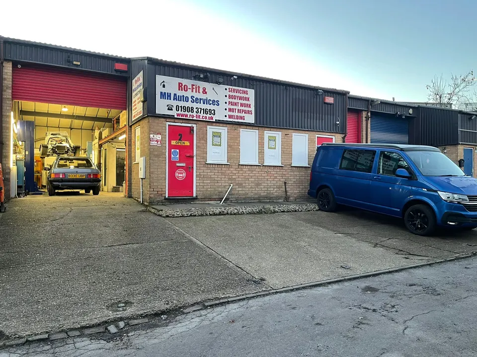 The MH Auto Services workshop on Sinclair Court, Bletchley, at dusk