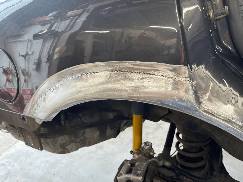 Rear wheel arch with new steel welded in and ground back